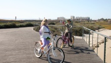 2 cyclists taking photos on Bayshore Bikeway